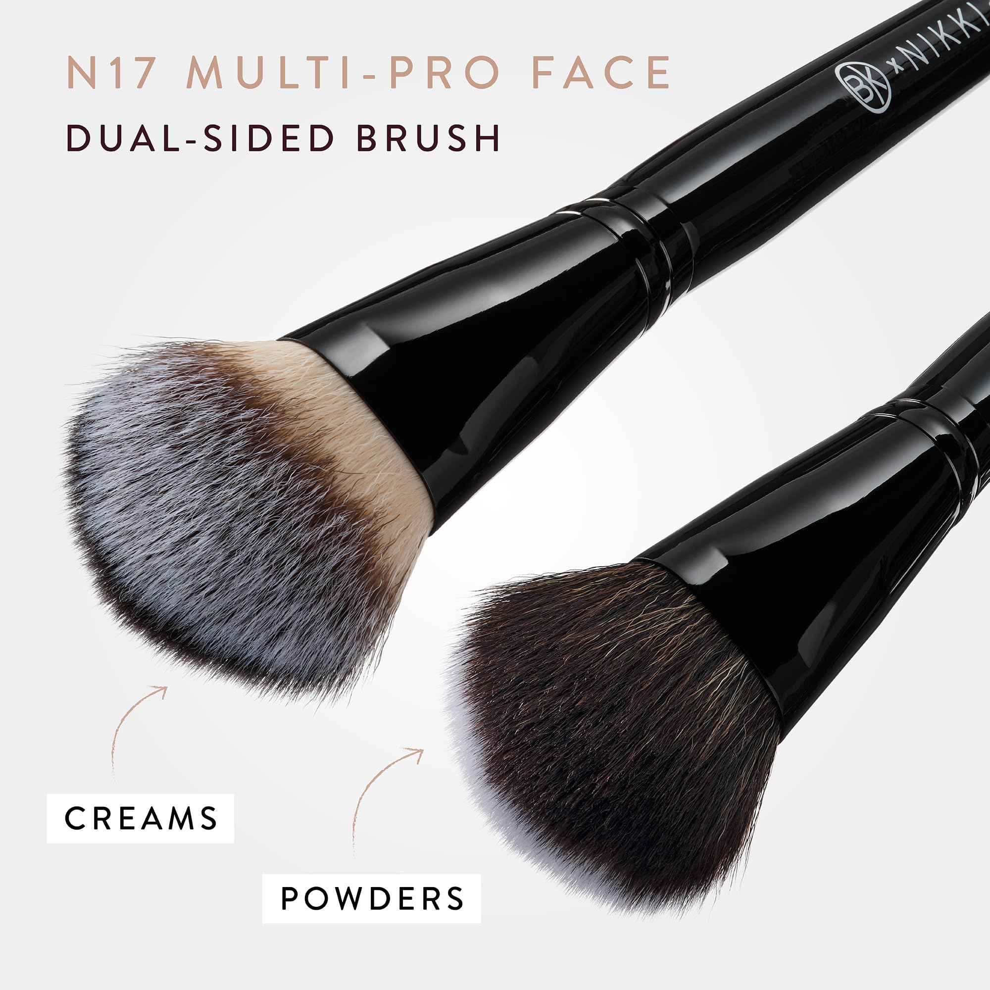 BK BEAUTY brush held in hand showing compact size for travel convenience