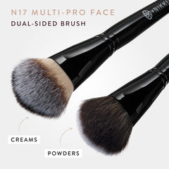 BK BEAUTY brush held in hand showing compact size for travel convenience