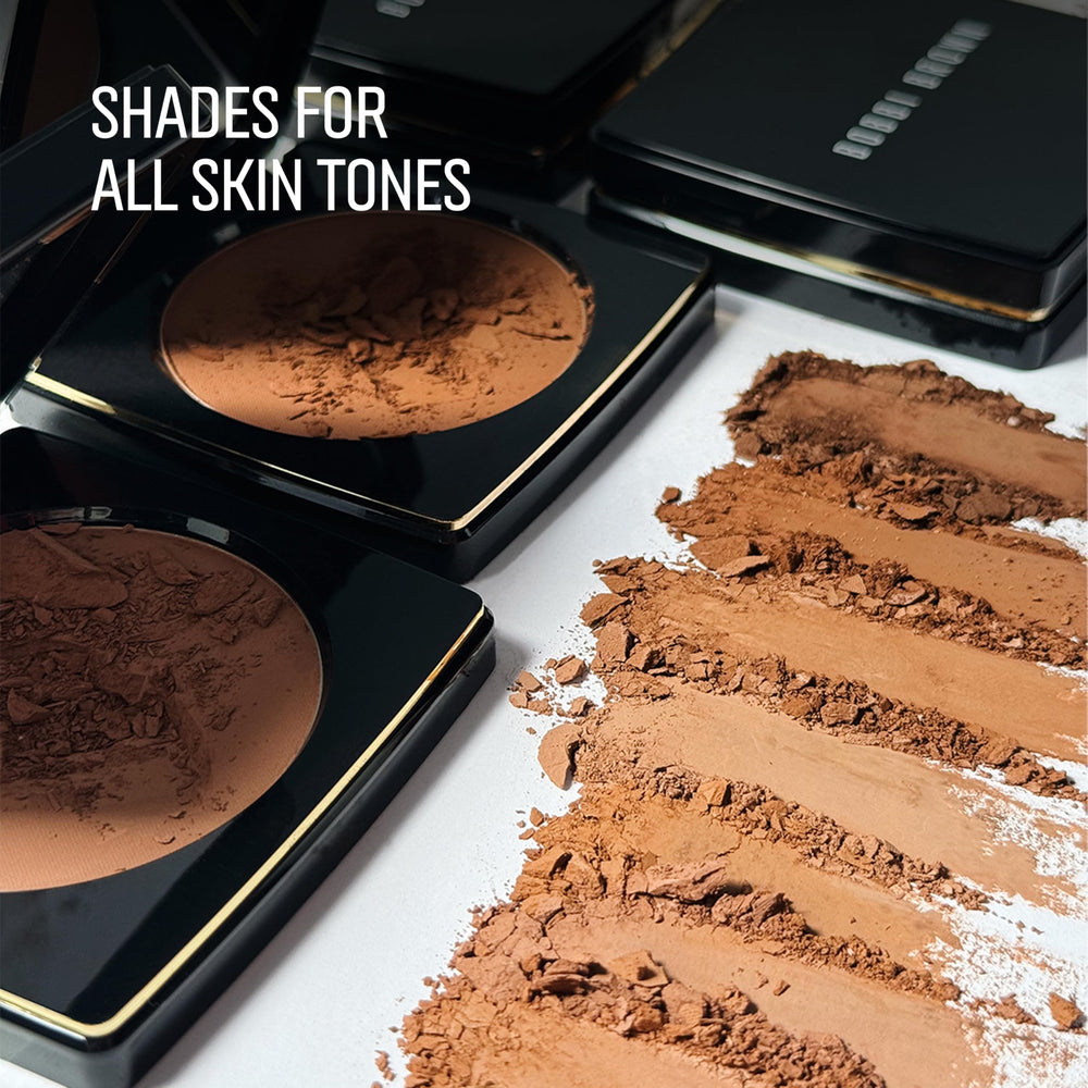 Bobbi Brown bronzing powder held in hand for size comparison and travel-friendly convenience benefit