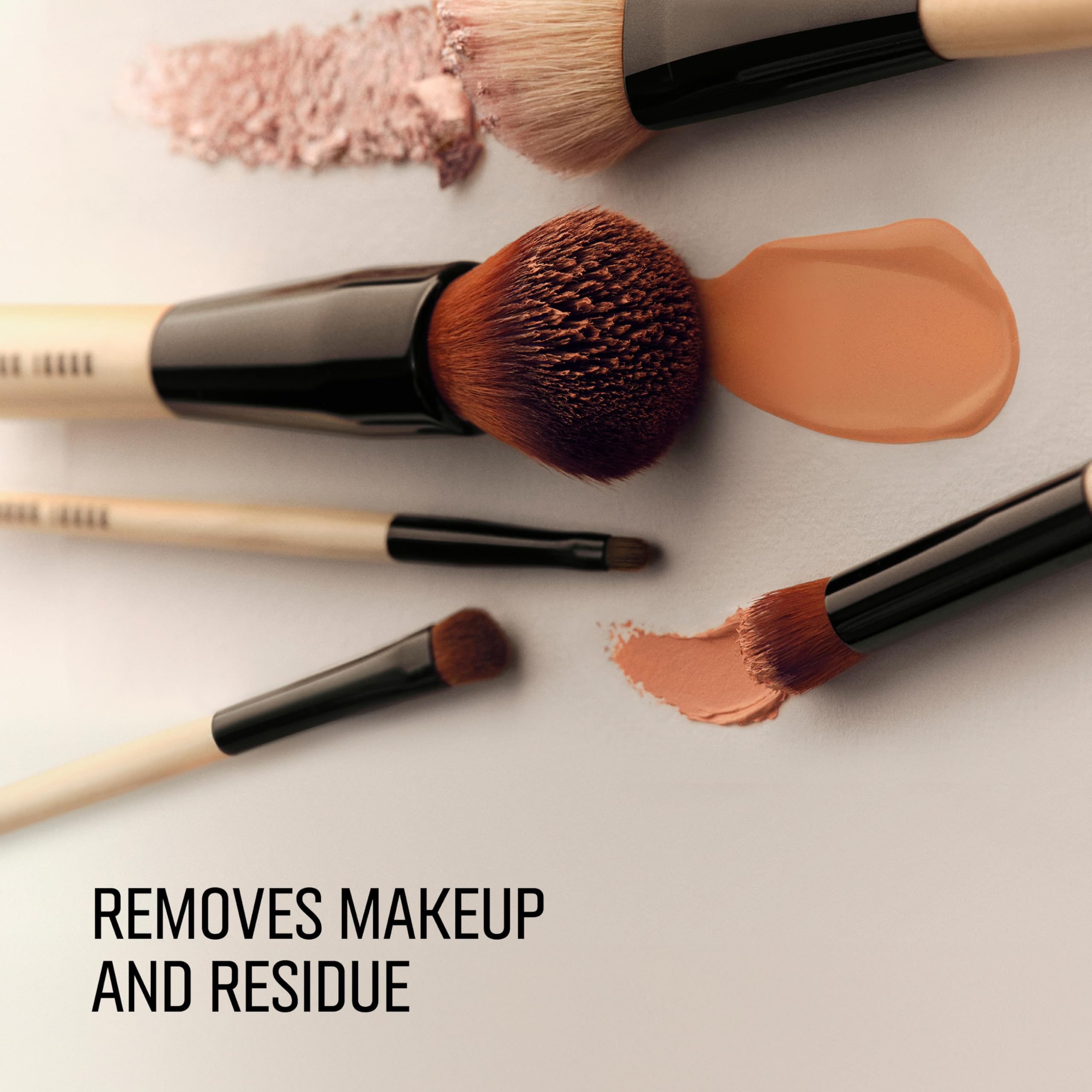 Bobbi Brown brush in use being cleaned to remove makeup buildup effectively