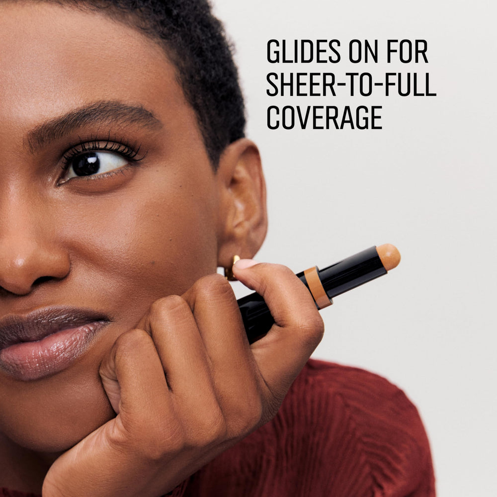 Bobbi Brown concealer next to lipstick showing compact size for travel