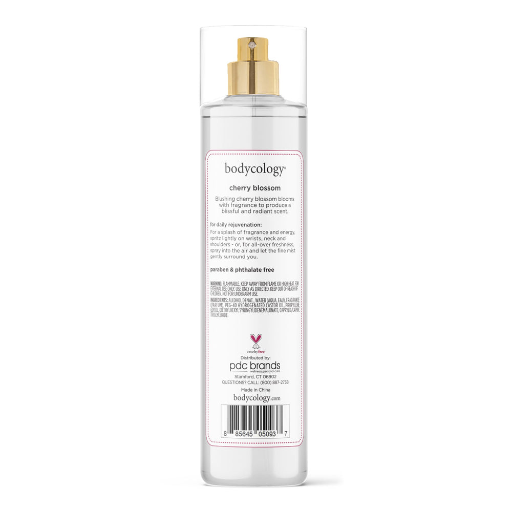 Person outdoors with Bodycology mist in garden showing fresh floral confidence benefit
