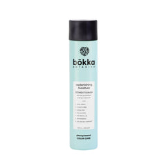 Bokka Botanika in bathroom hands applying conditioner, improves detangling and shine