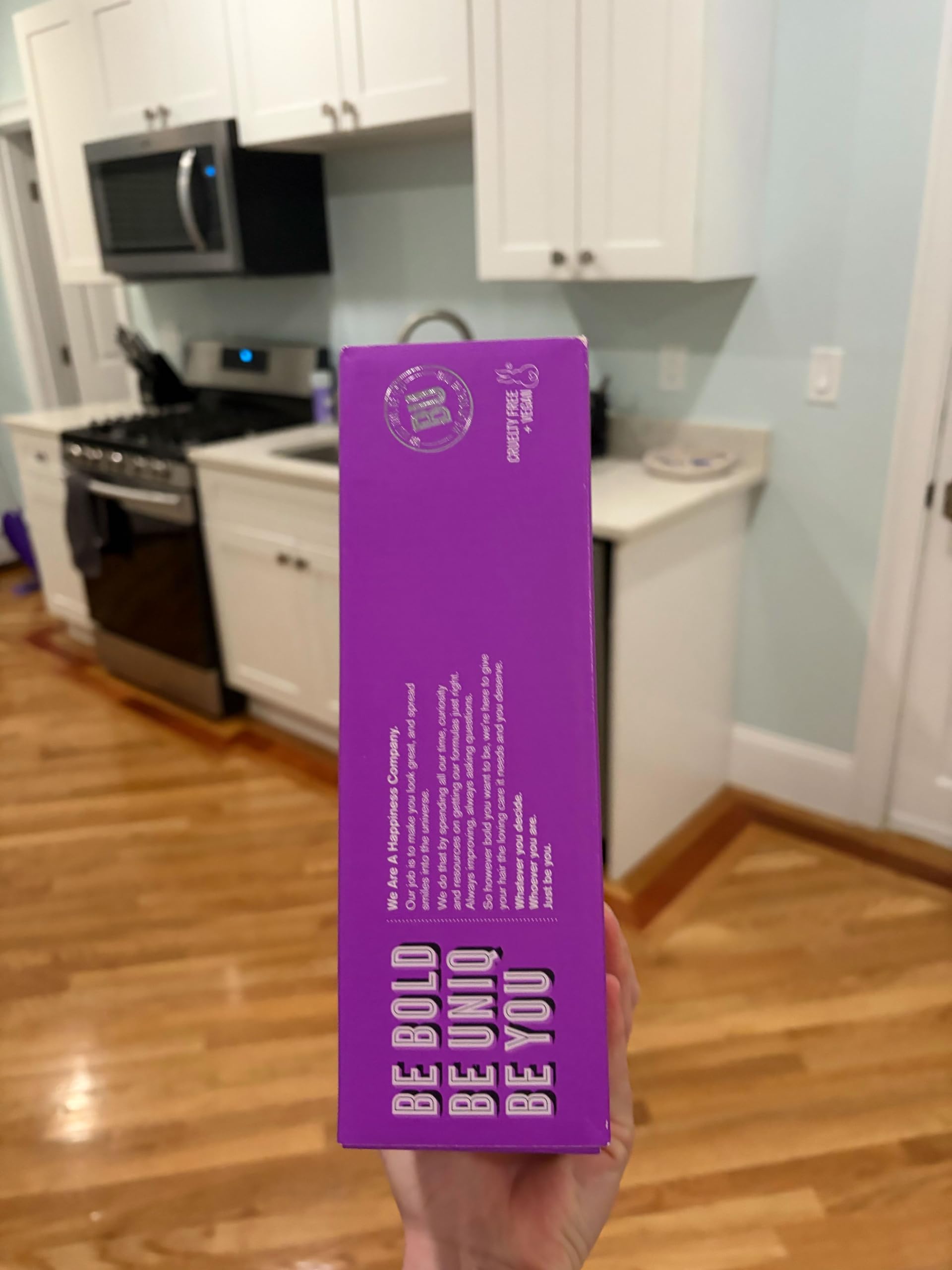 BOLD UNIQ purple conditioner label focused shot showing nourishing formula