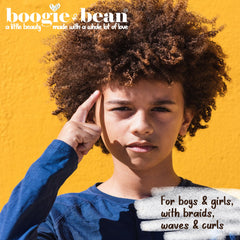 Child braid being styled with Boogie and Bean creme for neat, defined braids
