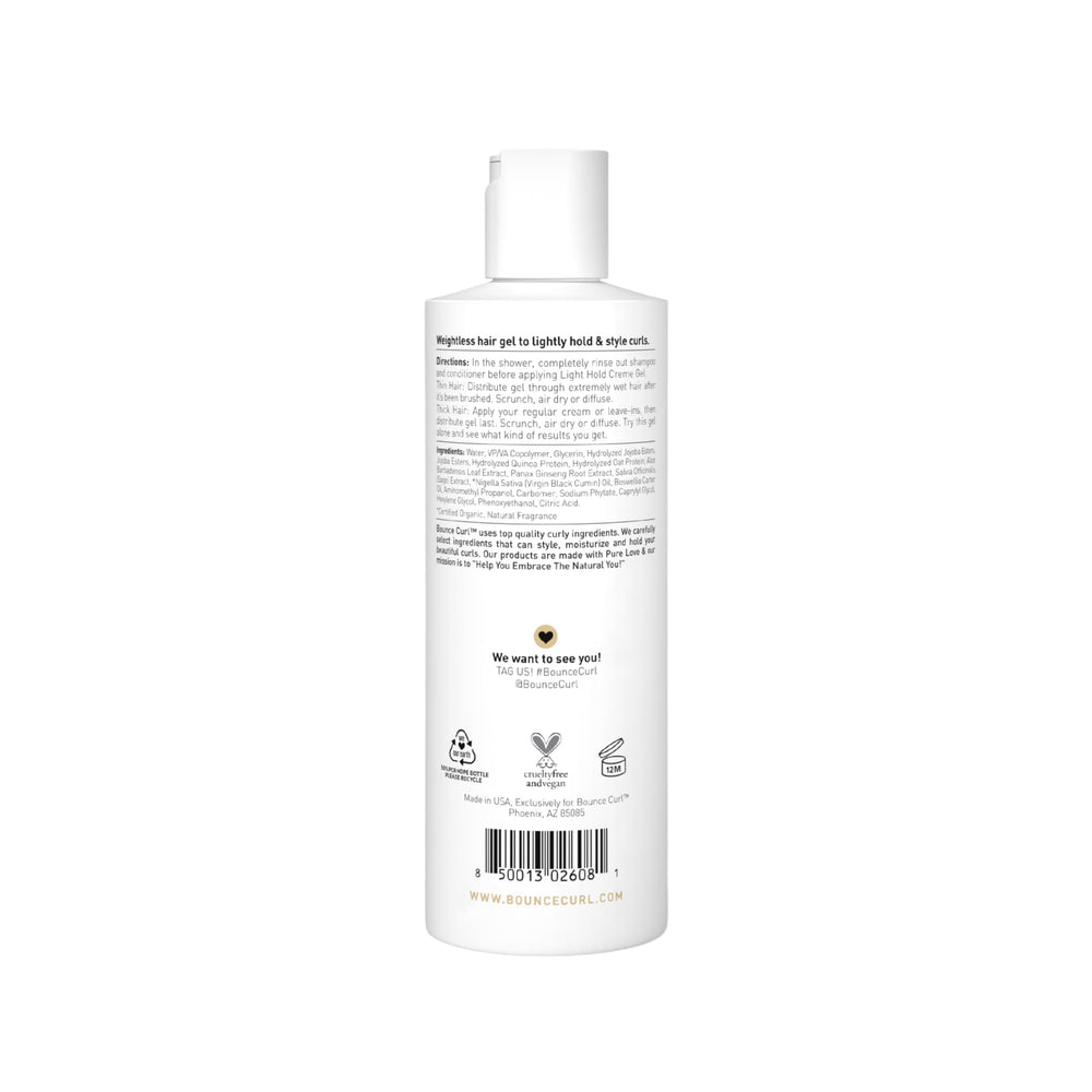 Bounce Curl product staged with tropical fruit, hinting at scent profile