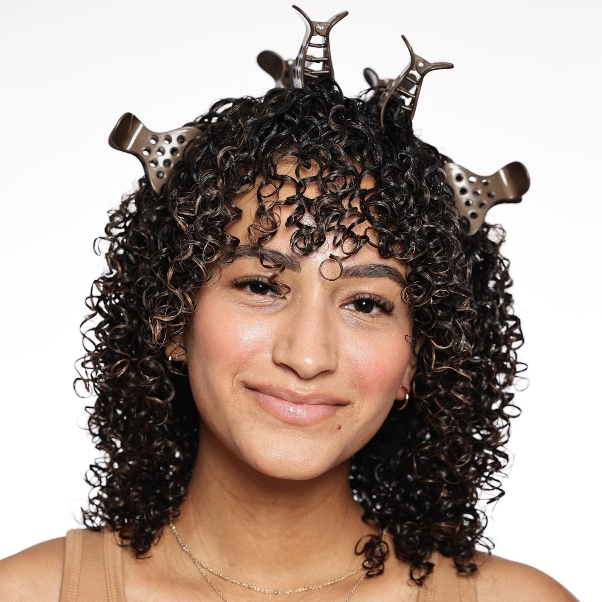 Bounce Curl clips placed along crown demonstrating targeted lift and fuller shape