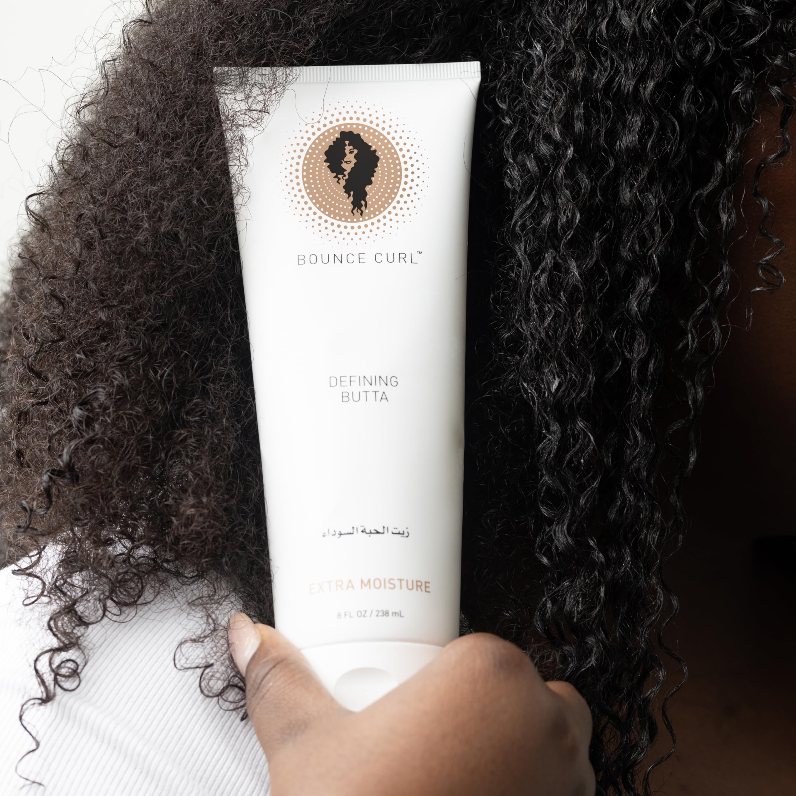 Bounce Curl cream texture close-up displaying rich, spreadable moisture