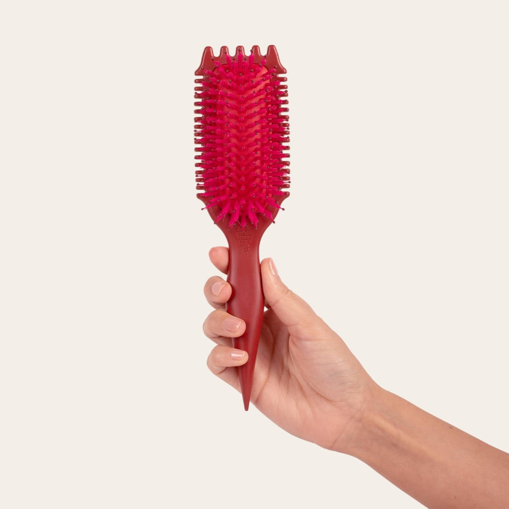 Bounce Curl brush placed on vanity in lifestyle scene for everyday styling use