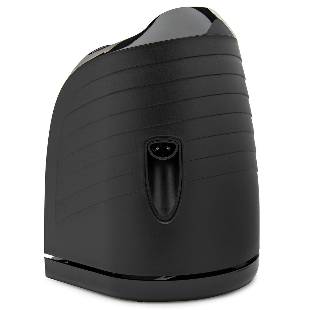Braun base held in hand for size comparison showing compact, space-saving benefit