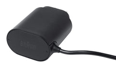 Braun charger next to shaver for scale showing size comparison benefit easy storage