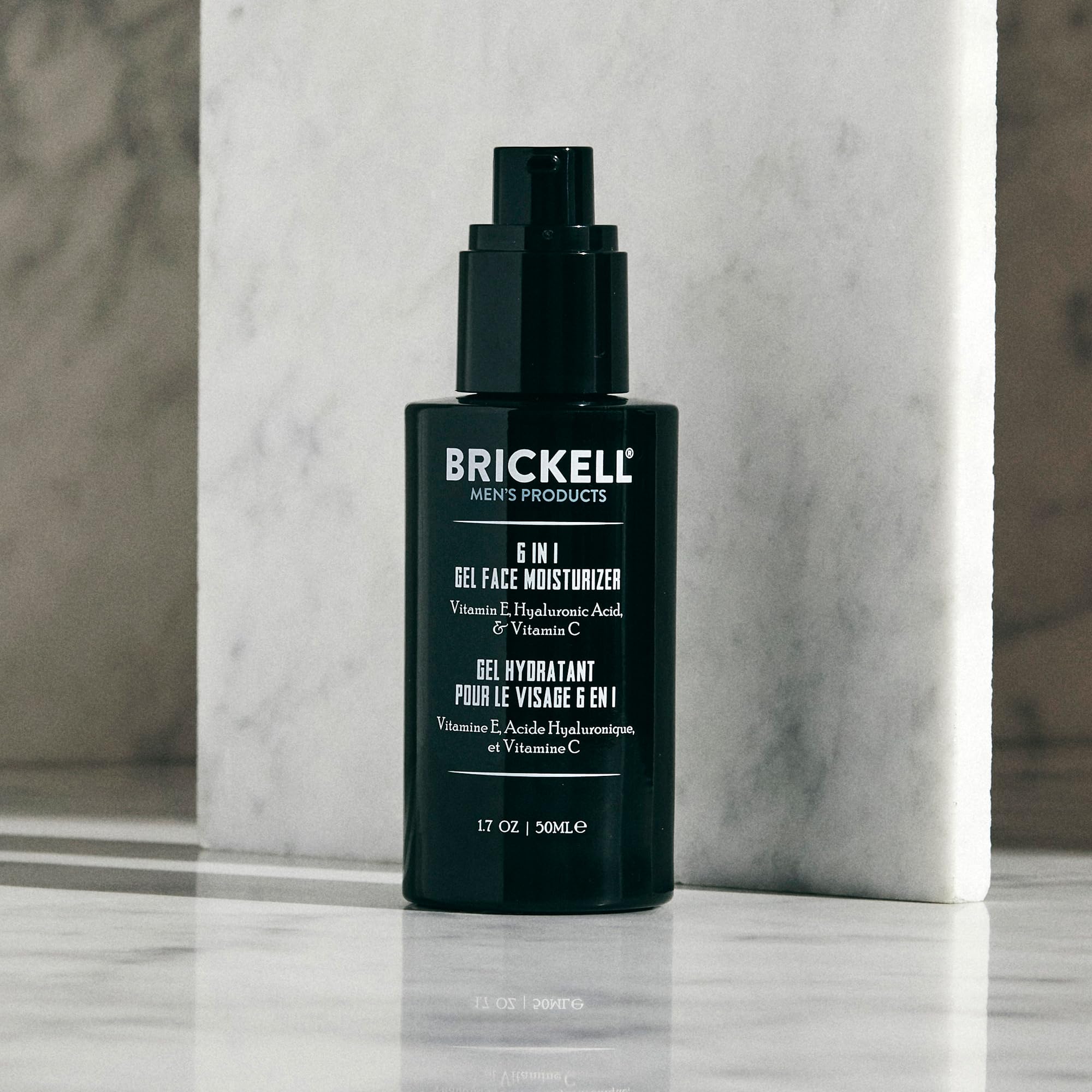 Brickell Men's applying gel after shaving to jawline demonstrating soothing, non-greasy benefit