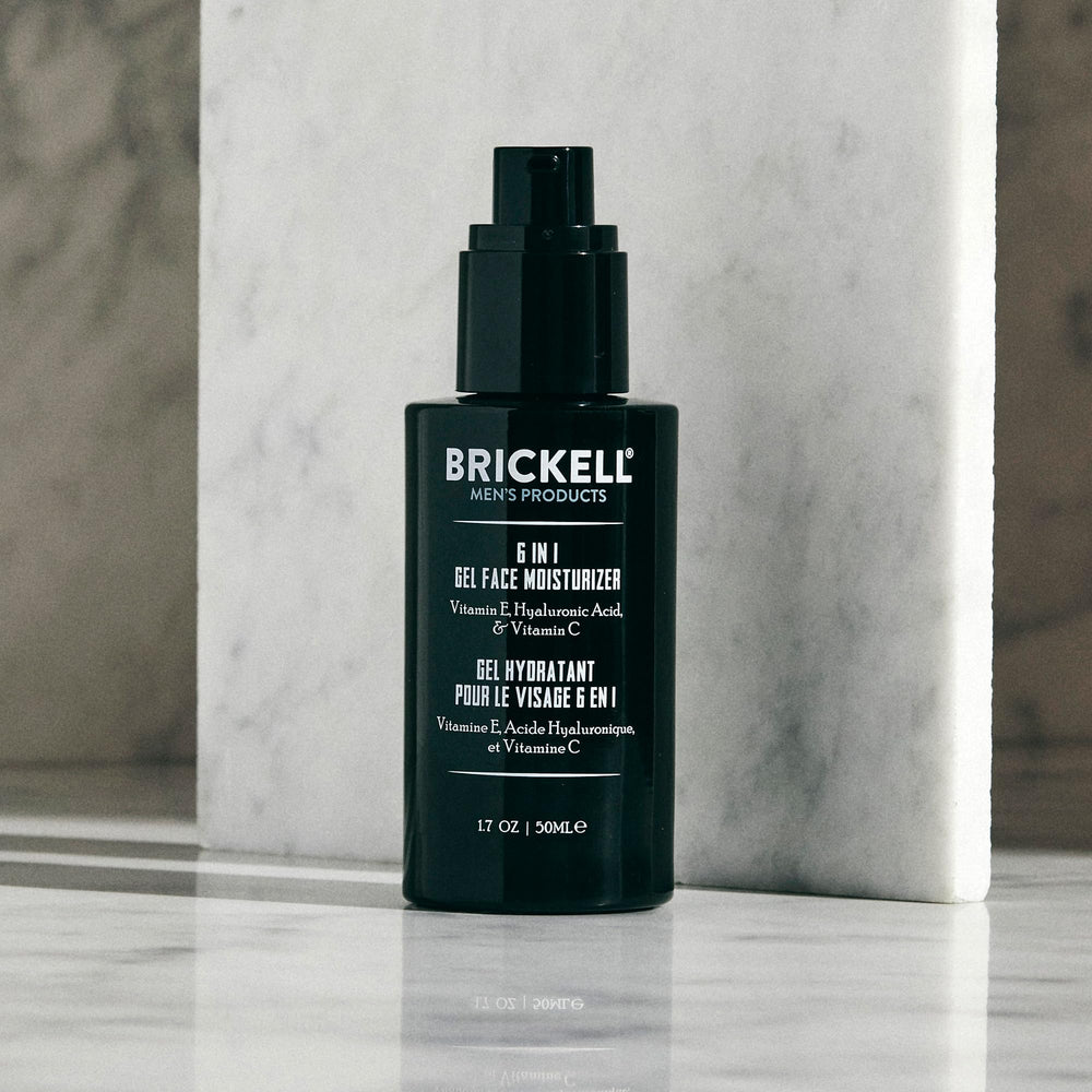 Brickell Men's applying gel after shaving to jawline demonstrating soothing, non-greasy benefit