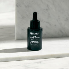Brickell serum being applied to a hand demonstrating fast absorption benefit