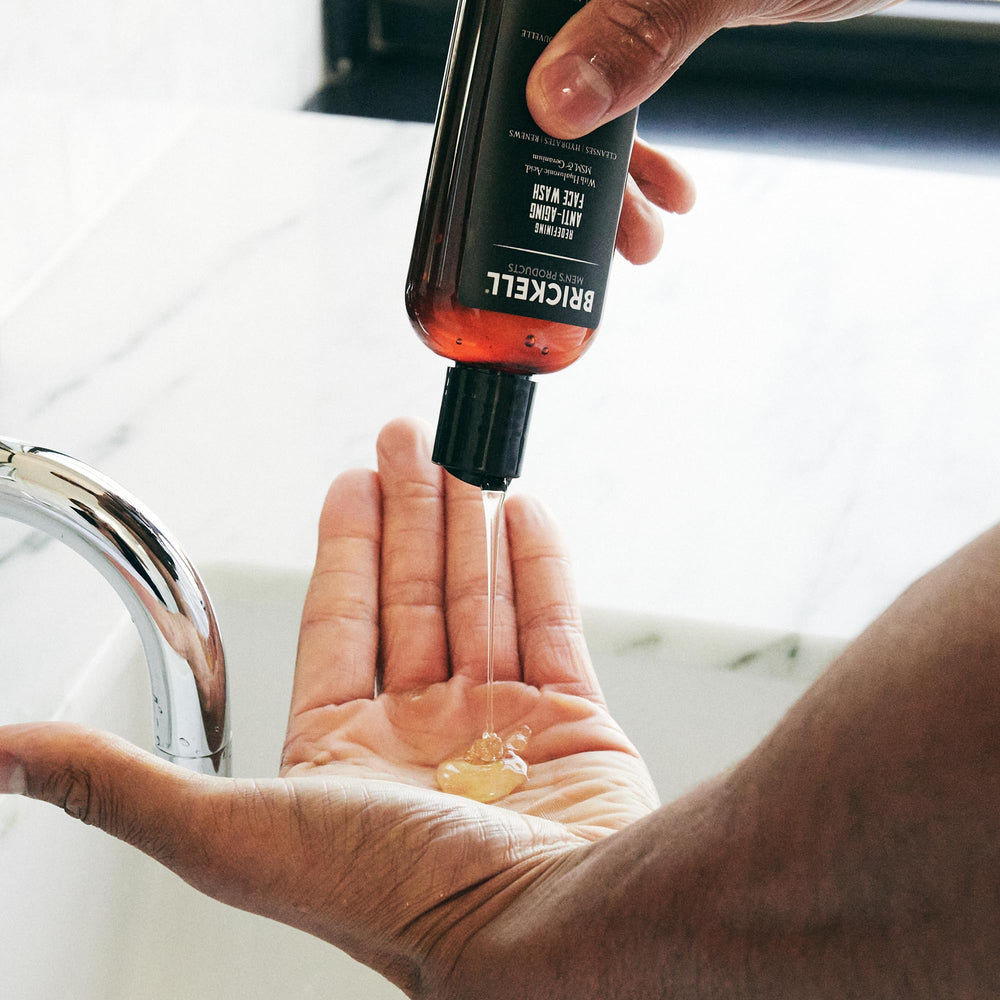 Brickell Men’s bottle on bathroom counter as part of morning routine for refreshed look benefit