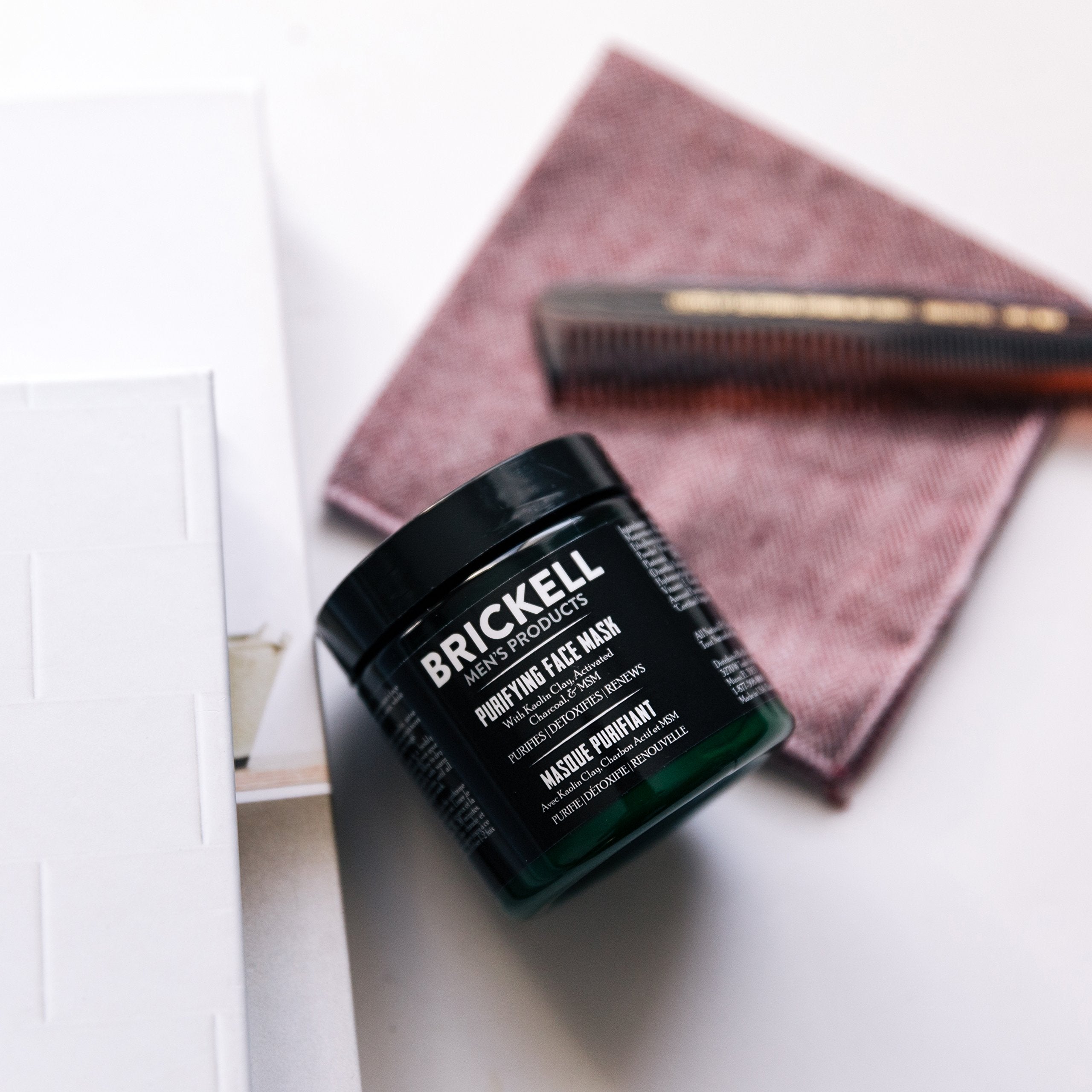 Brickell ingredient flatlay with charcoal and kaolin for detox