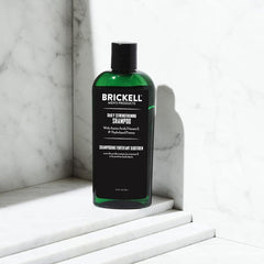 Brickell Men's Products shampoo pouring to show smooth foam and easy application benefit