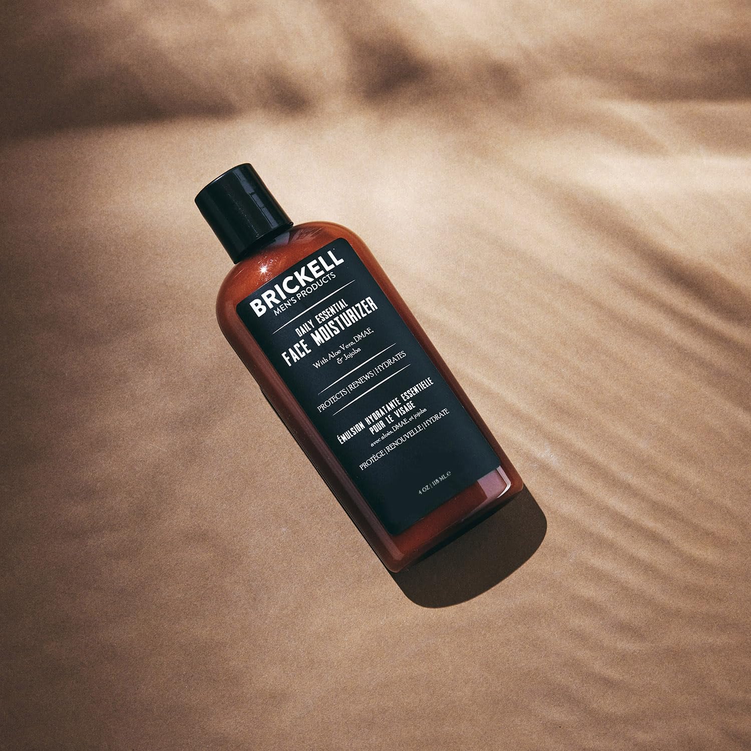 Brickell Men's Products in hand demonstrates 4-ounce scale and travel-friendly convenience