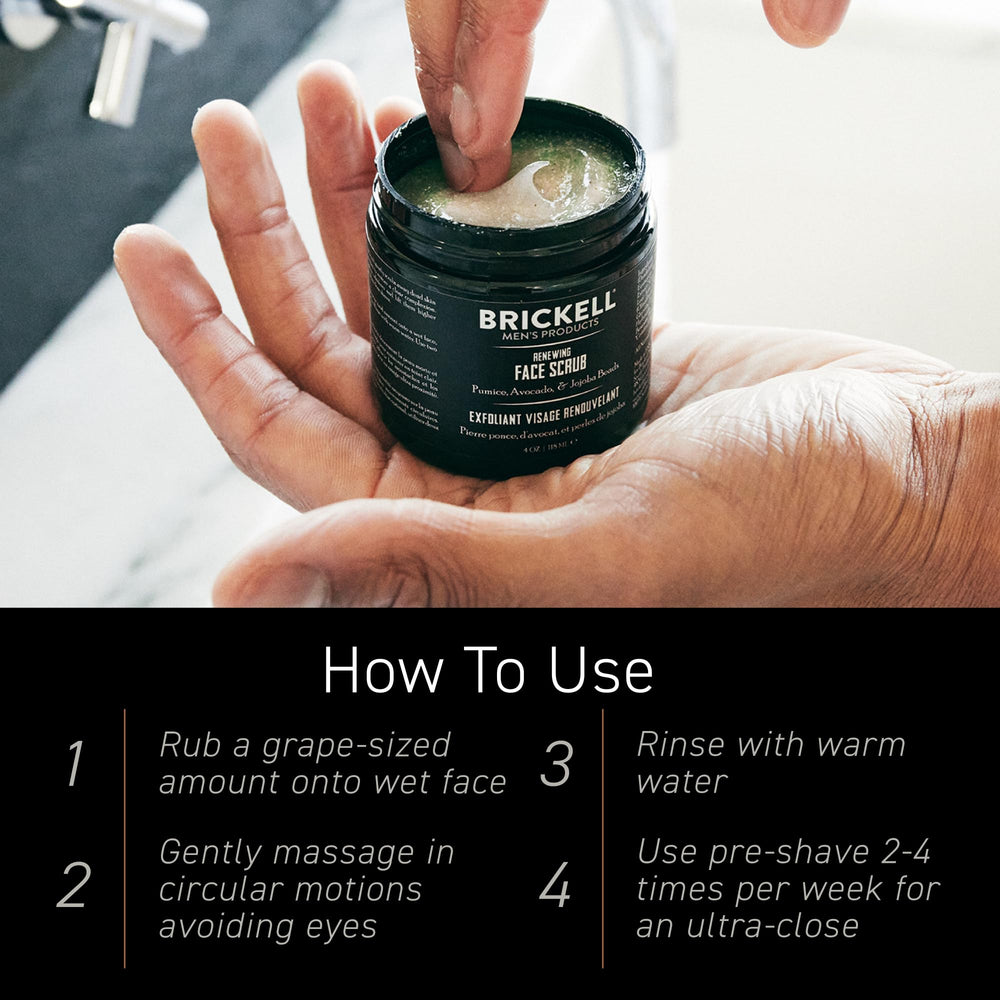 Brickell Men’s scrub held in hand to show 4-ounce scale and easy handling