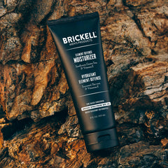 Brickell 8 ounce tube next to sunglasses for scale and portability benefit