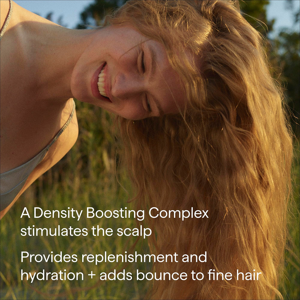 Briogeo conditioner being applied in shower for manageable hair