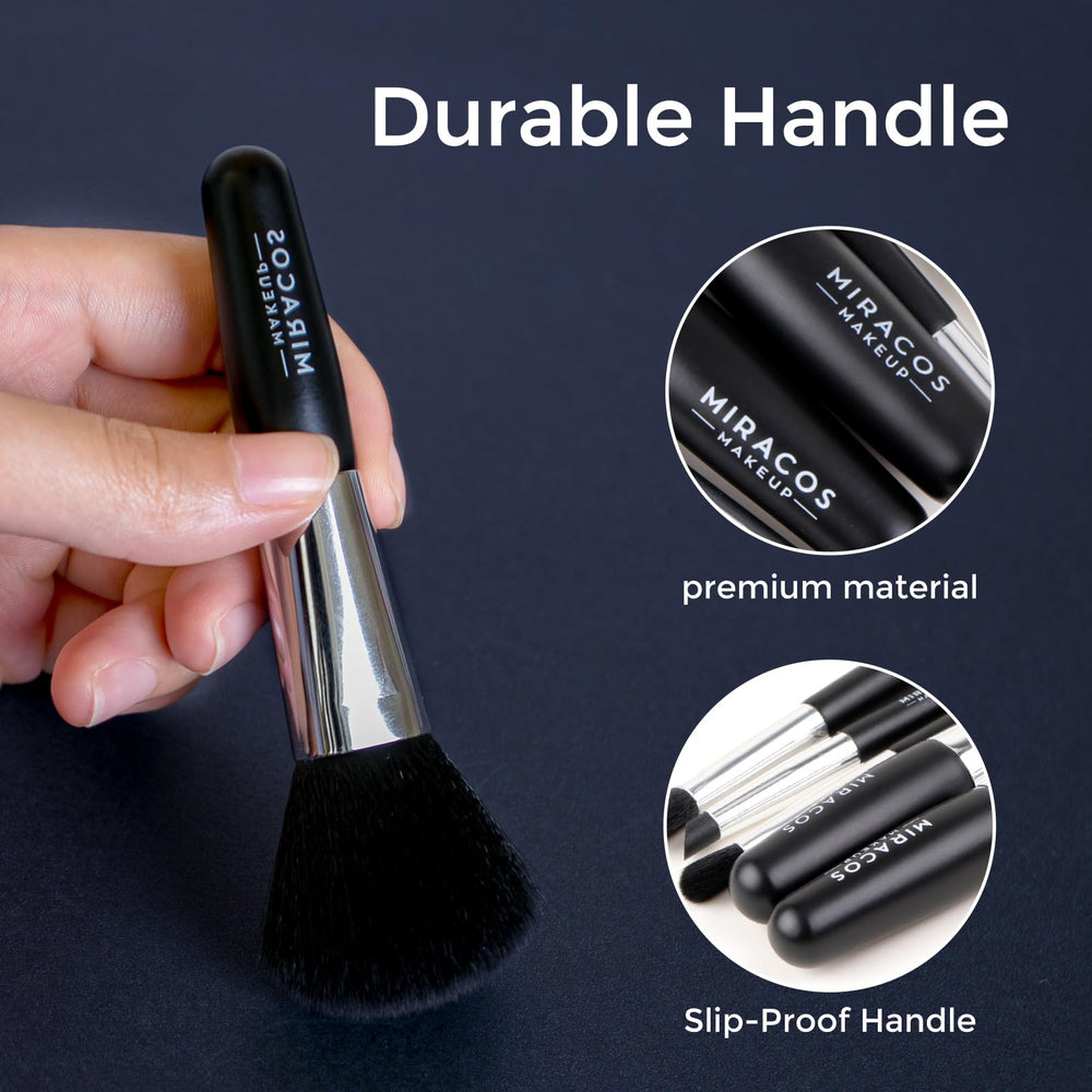 Brush Master brush held in hand to show compact size and easy travel-friendly scale