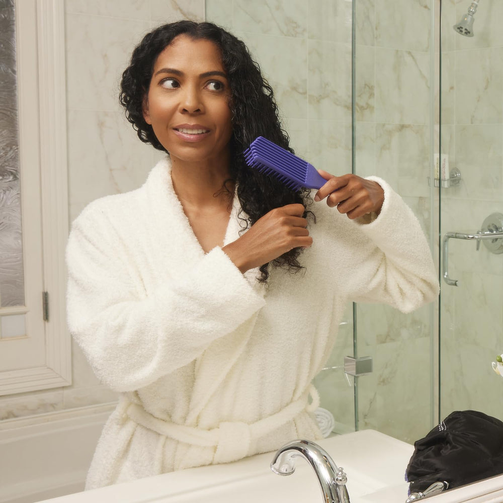 Brush With The Best bristles bending around a knot to ease tangles gently