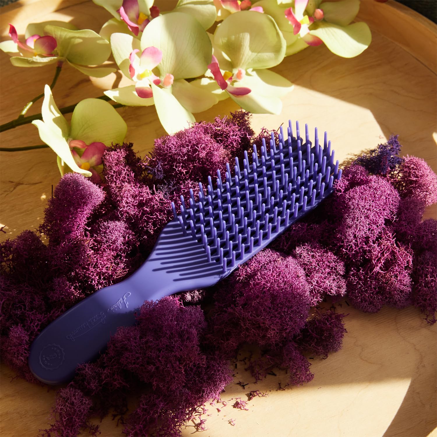 Brush With The Best used on curly hair demonstrating smooth coil definition benefit