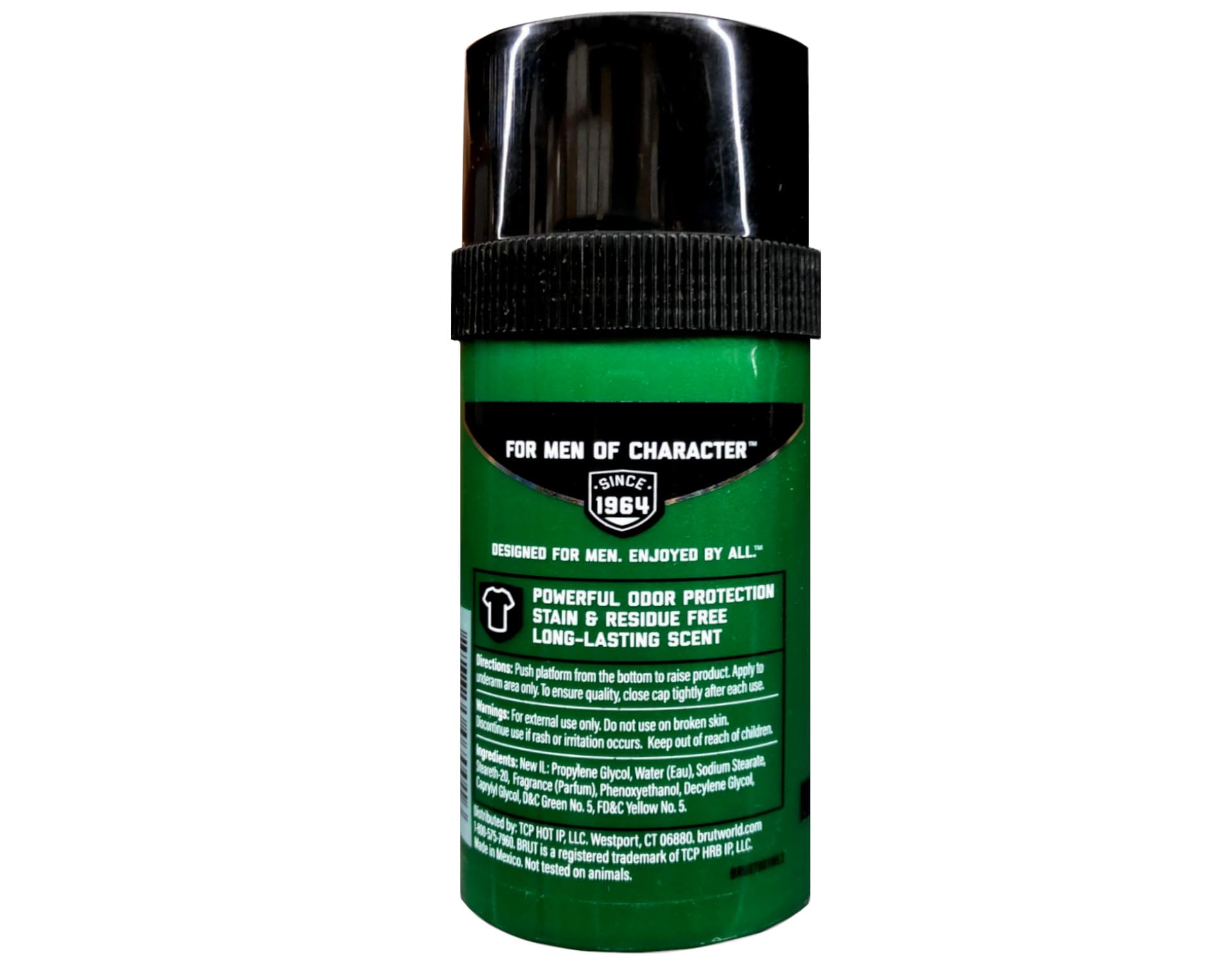 Brut stick next to everyday items showing compact 2.7 oz travel-friendly size
