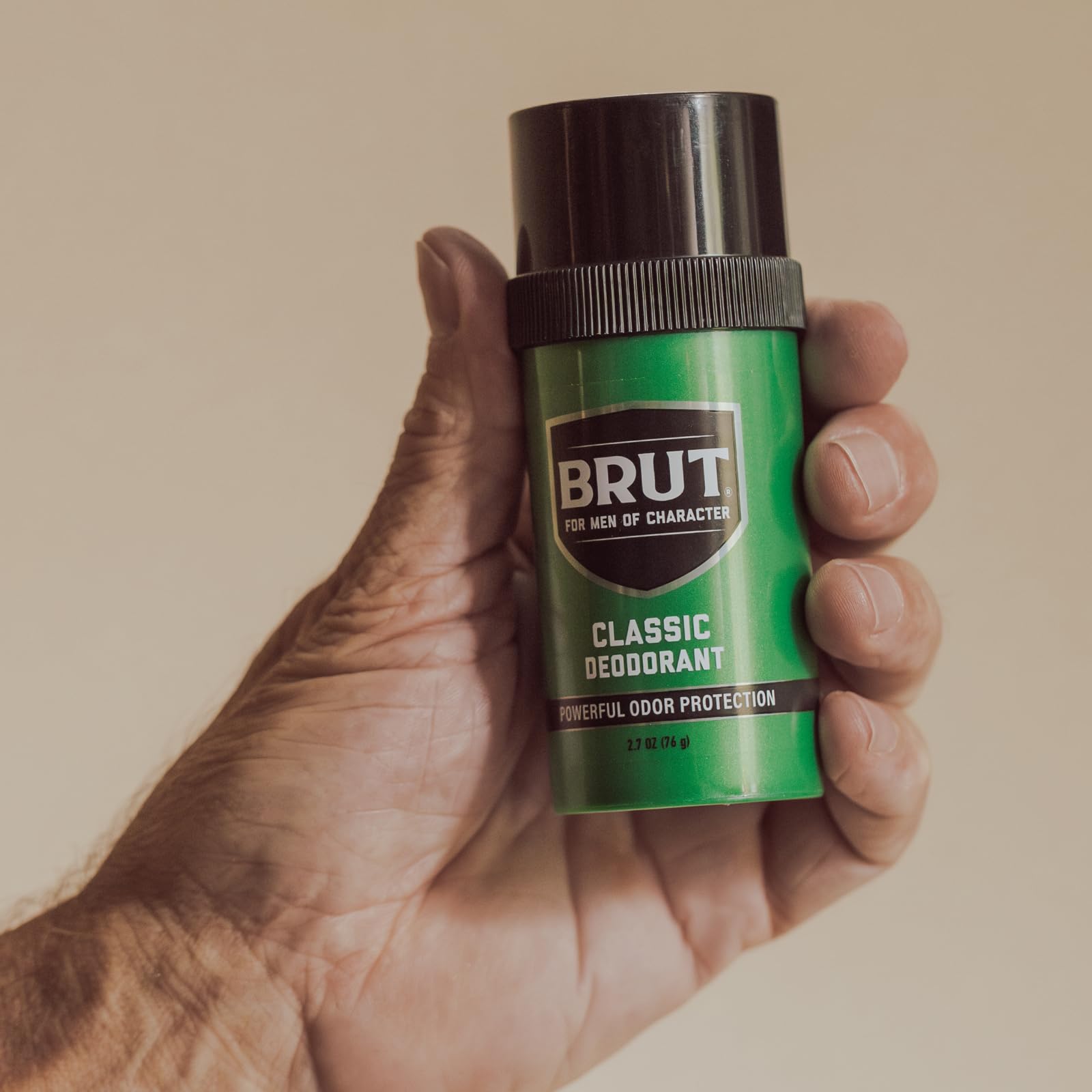 BRUT deodorant being applied to underarm demonstrating quick, no-mess daily use benefit