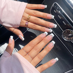 BTArtbox hand applying a press-on nail demonstrating fast ten-minute finish benefit