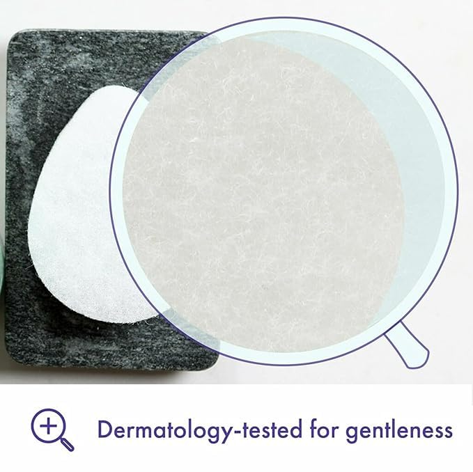 Hand holding Buf-Puf sponge to show size and easy grip for daily cleansing