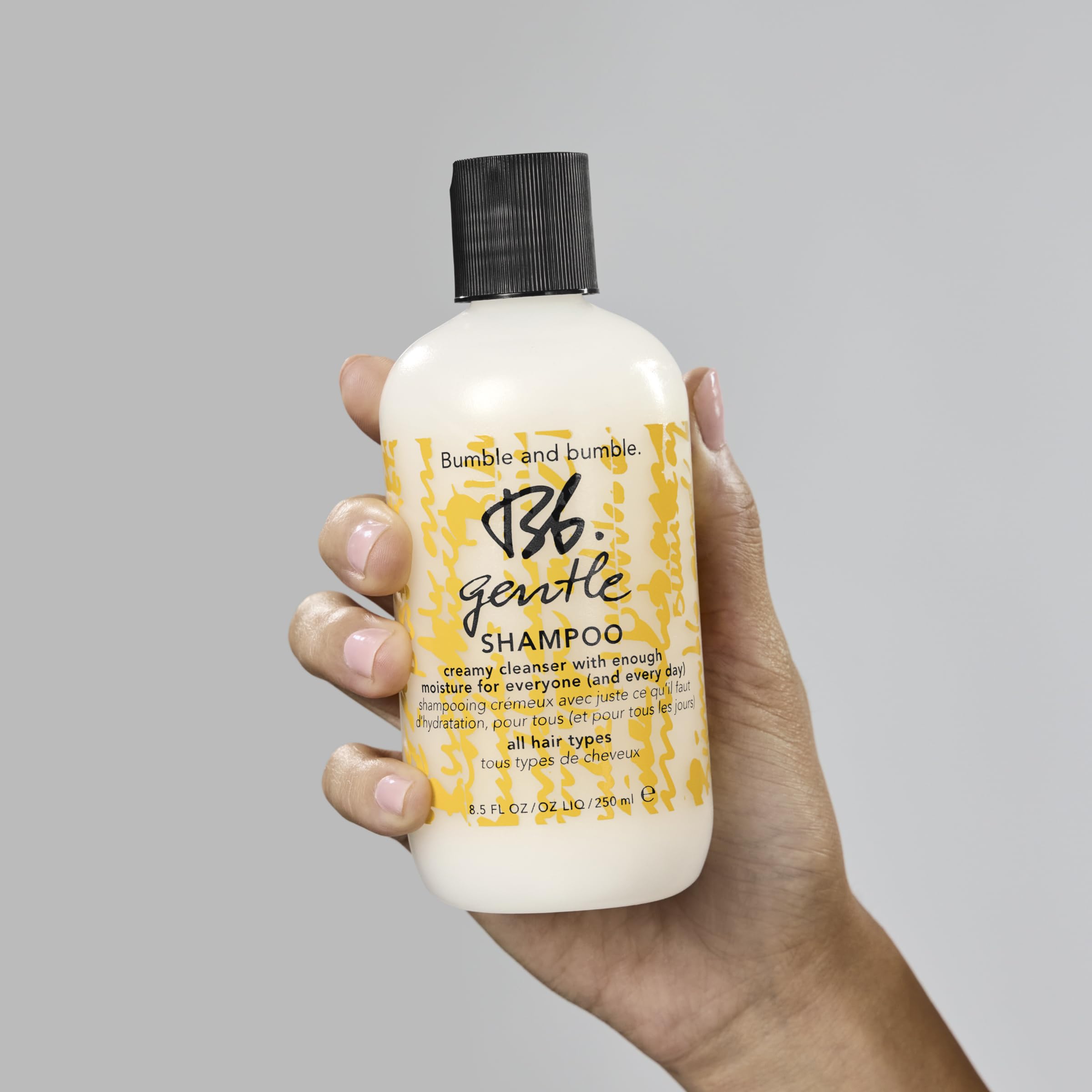 Bumble and bumble bottle on bathroom shelf suggesting everyday routine boost