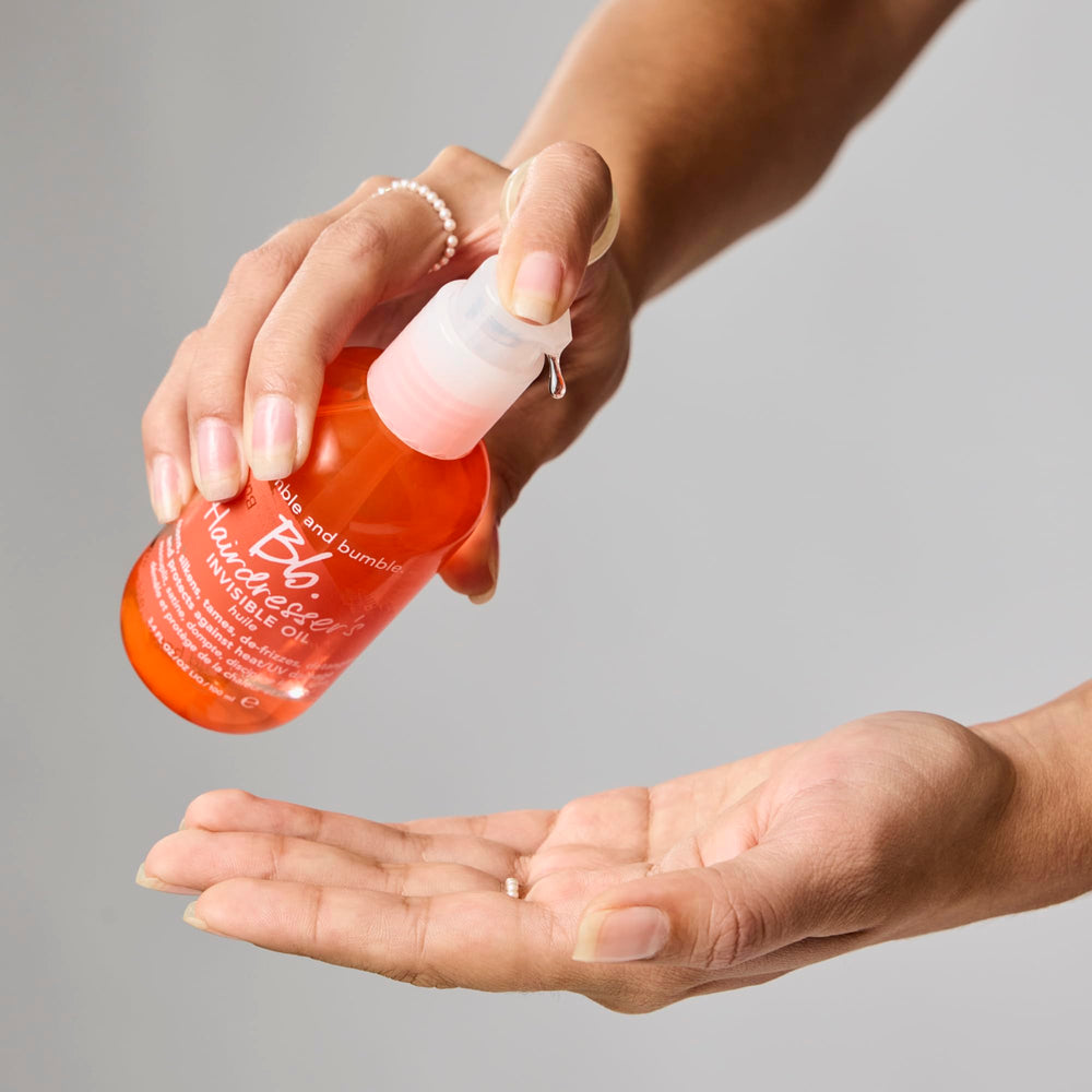 Bumble and bumble travel size next to passport emphasizes portability and travel readiness