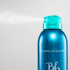 Bumble and bumble close-up on textured hair showing touchable, brushable finish benefit
