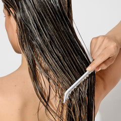 Bumble and bumble creamy conditioner texture close-up for slip and hydration
