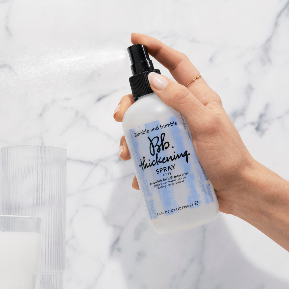 Bumble and bumble mist texture over hair strands demonstrating lightweight thickness benefit