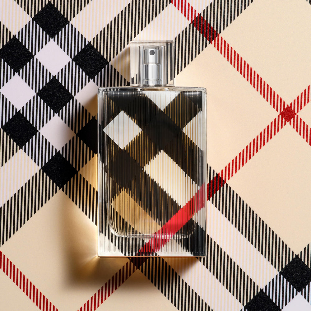 Burberry cap and atomizer close-up showing spray mechanism benefit: precise application