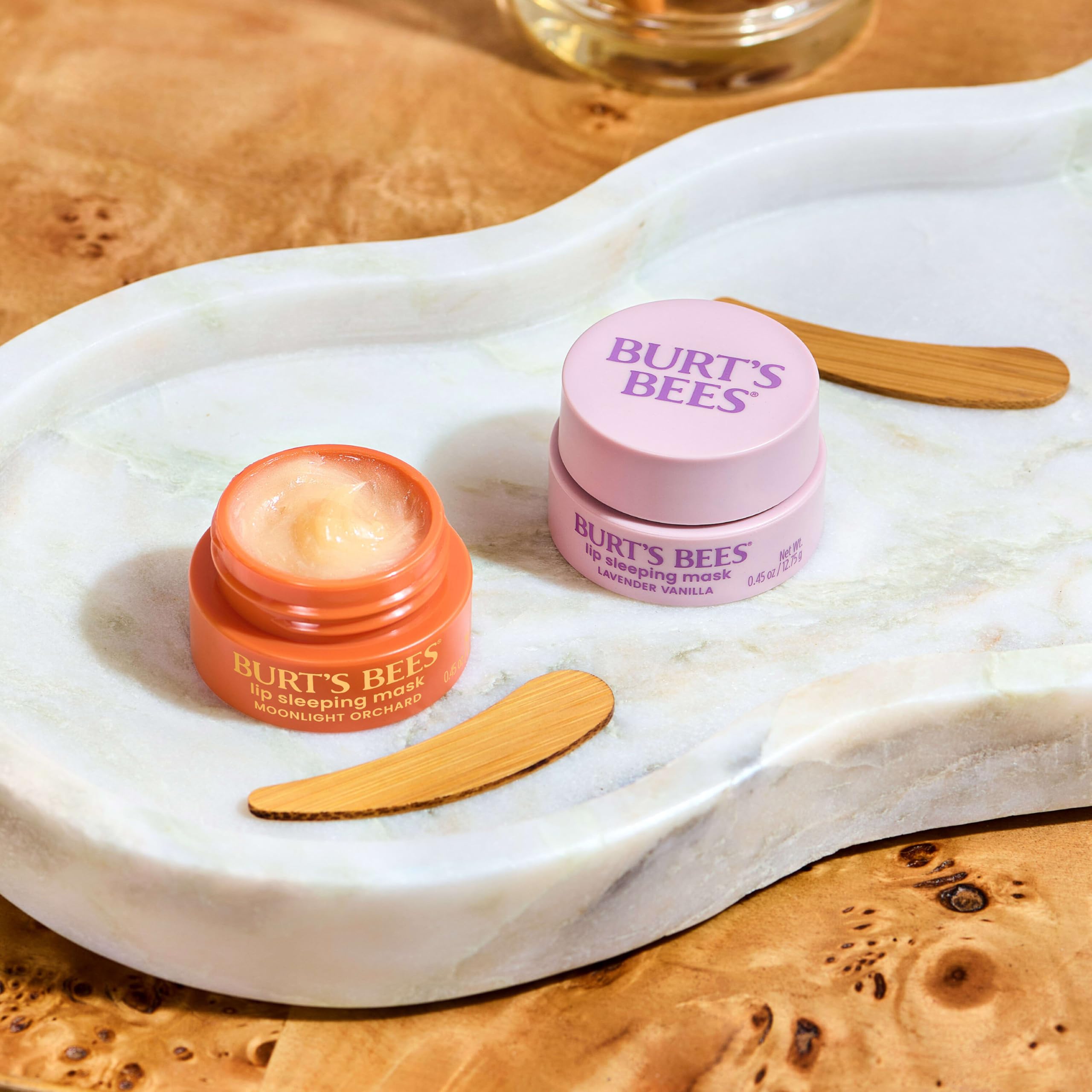 Burt's Bees lip mask being applied before sleep demonstrating overnight hydration