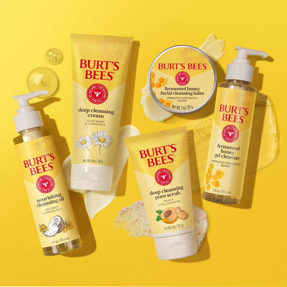 Hand holding Burt's Bees 4 oz tube for scale and travel-ready size