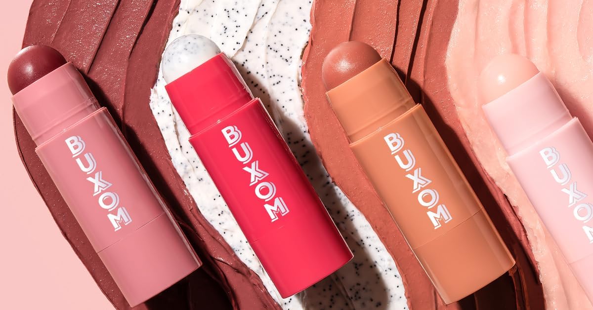 BUXOM First Crush in hand to illustrate compact 0.17 oz size and travel-friendly scale