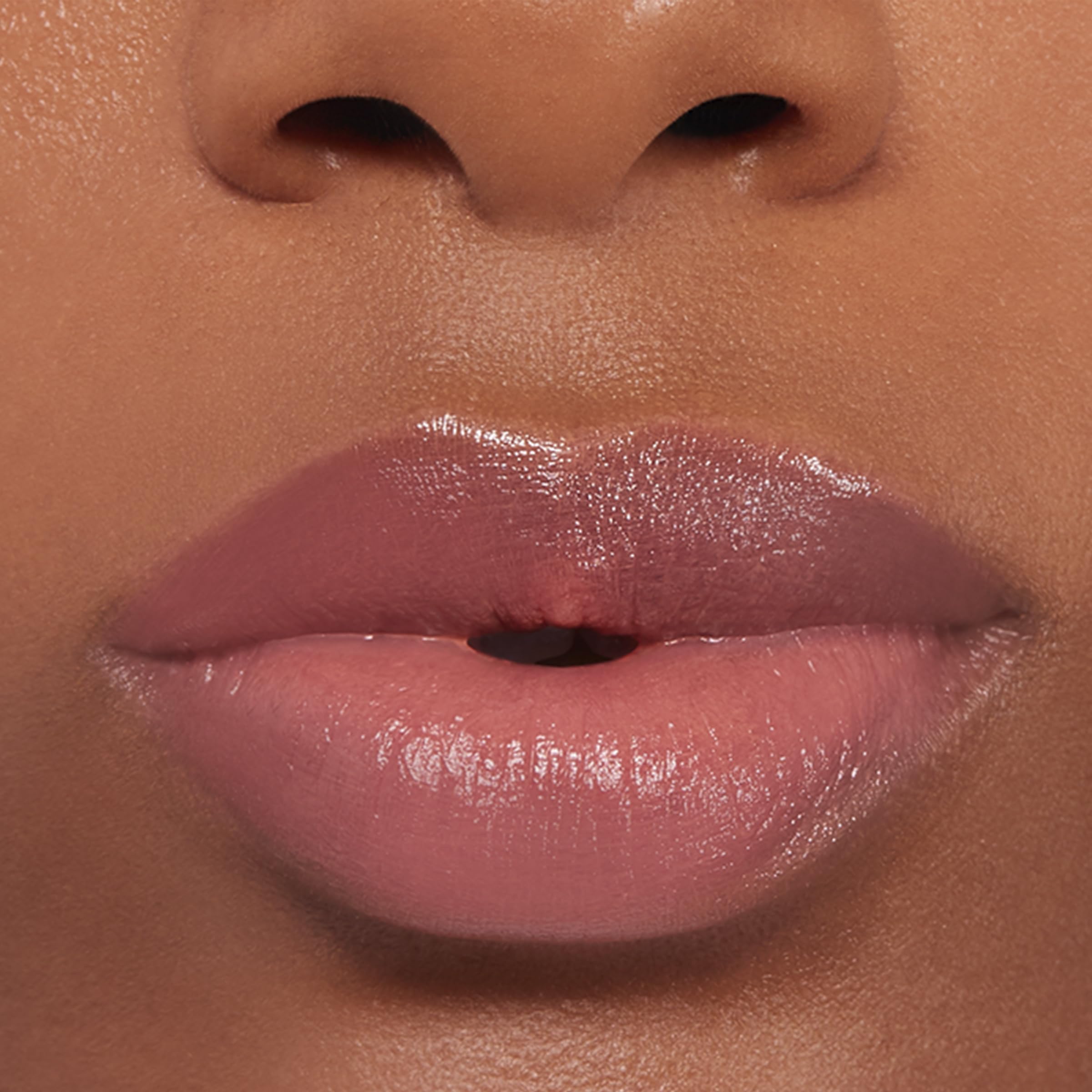 Buxom inner glow applied on lips demonstrating natural custom tint benefit