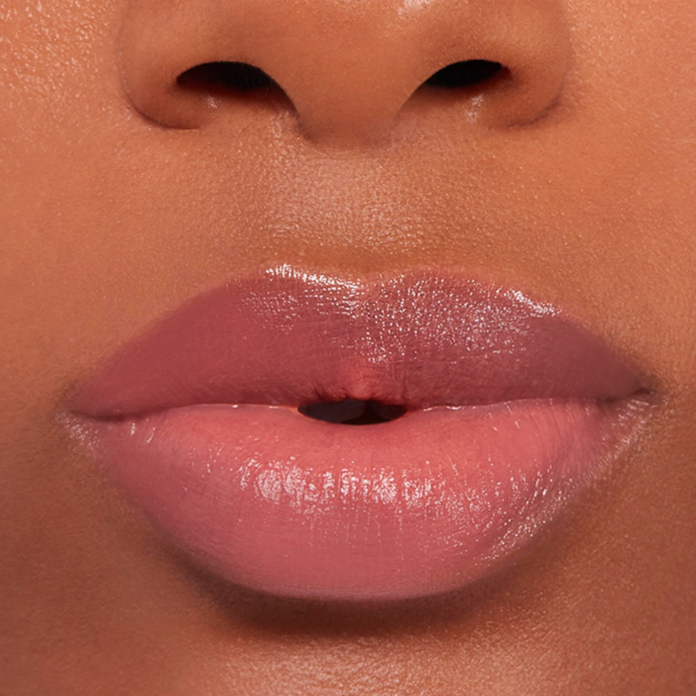 Buxom inner glow applied on lips demonstrating natural custom tint benefit