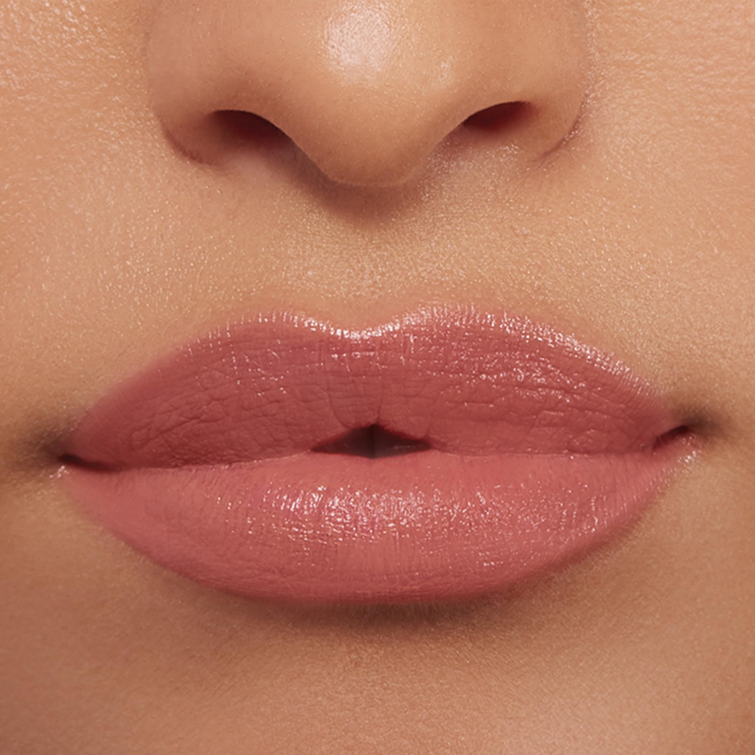 Buxom inner glow next to coin showing compact travel-friendly size advantage