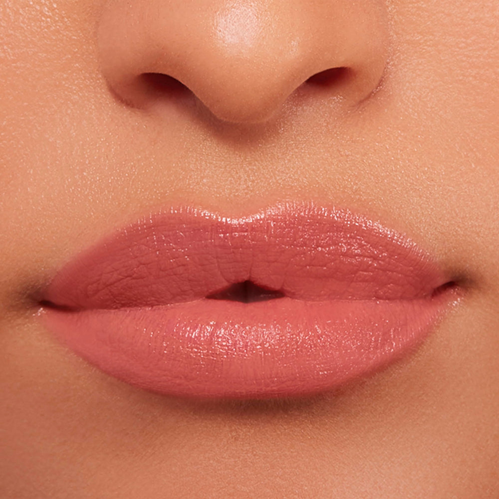 Buxom inner glow next to coin showing compact travel-friendly size advantage