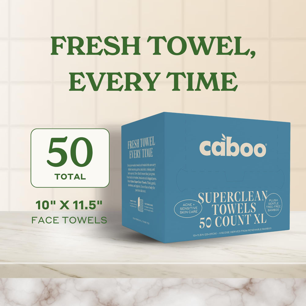 Caboo unfolded towel beside a ruler showing extra-large 10x11.5 size