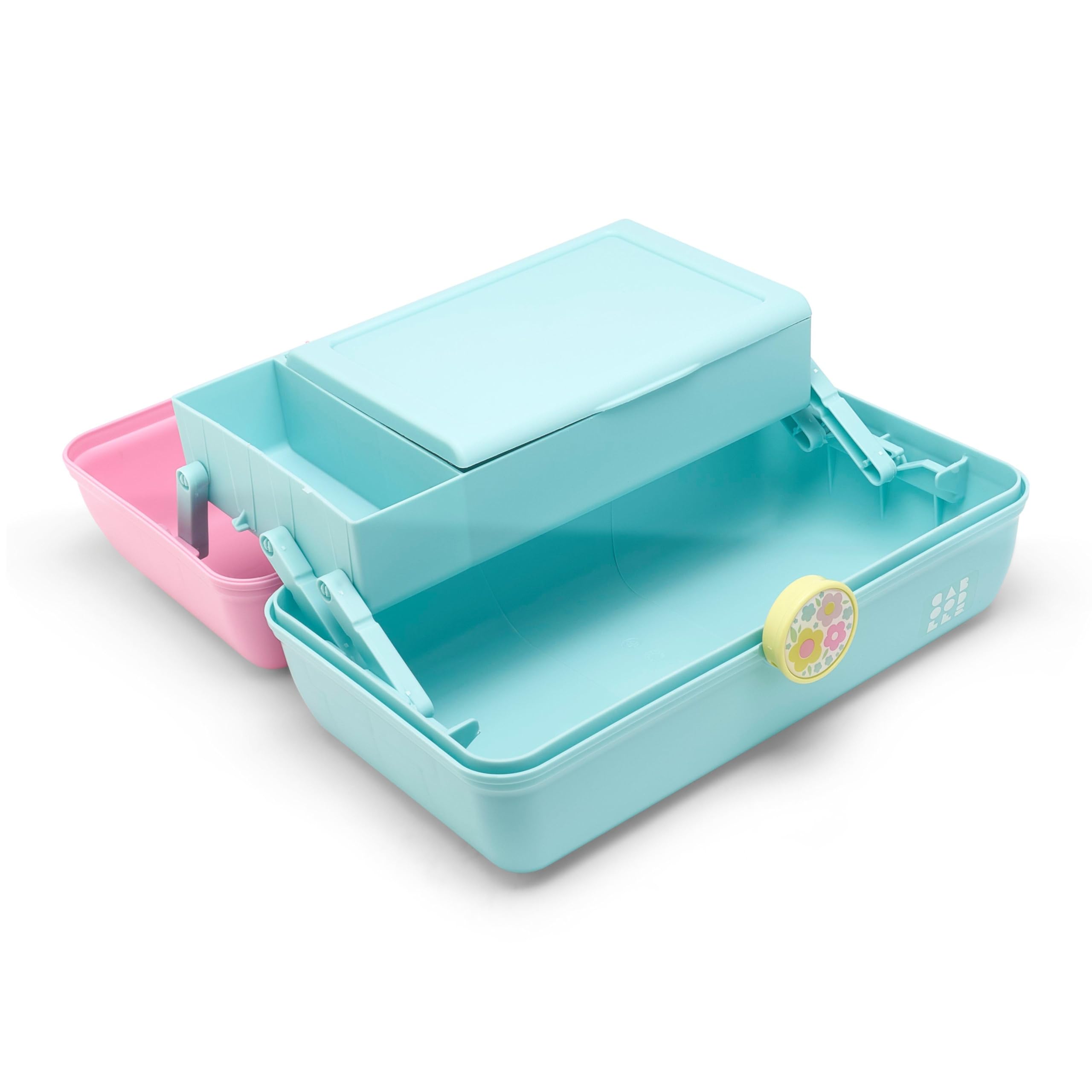 Caboodles next to makeup brushes showing scale and roomy lower compartment