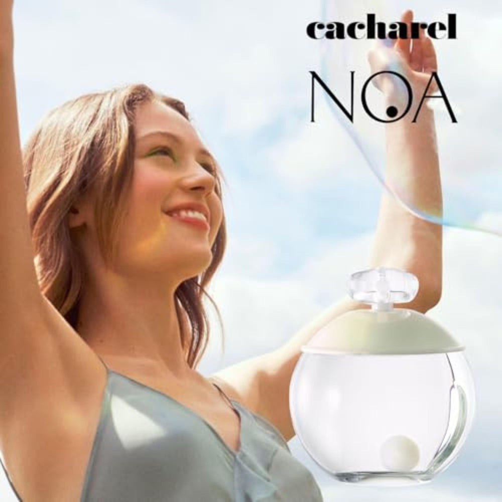 Cacharel Noa next to ruler showing 3.4 oz scale for practical size reference