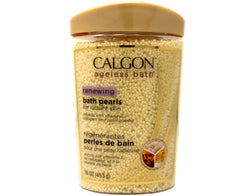 Calgon close-up of pearlescent beads dissolving, showing texture and quick dissolve benefit