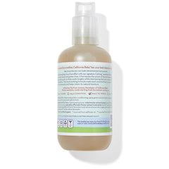 California Baby detangler spray in use on child's hair to ease knots and frizz